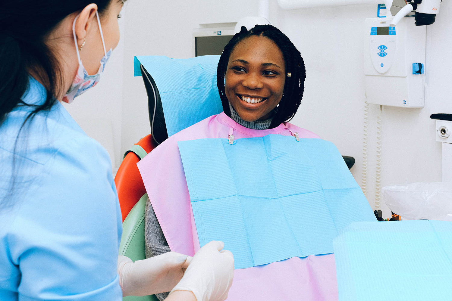 Dentist cleaning patient's teeth