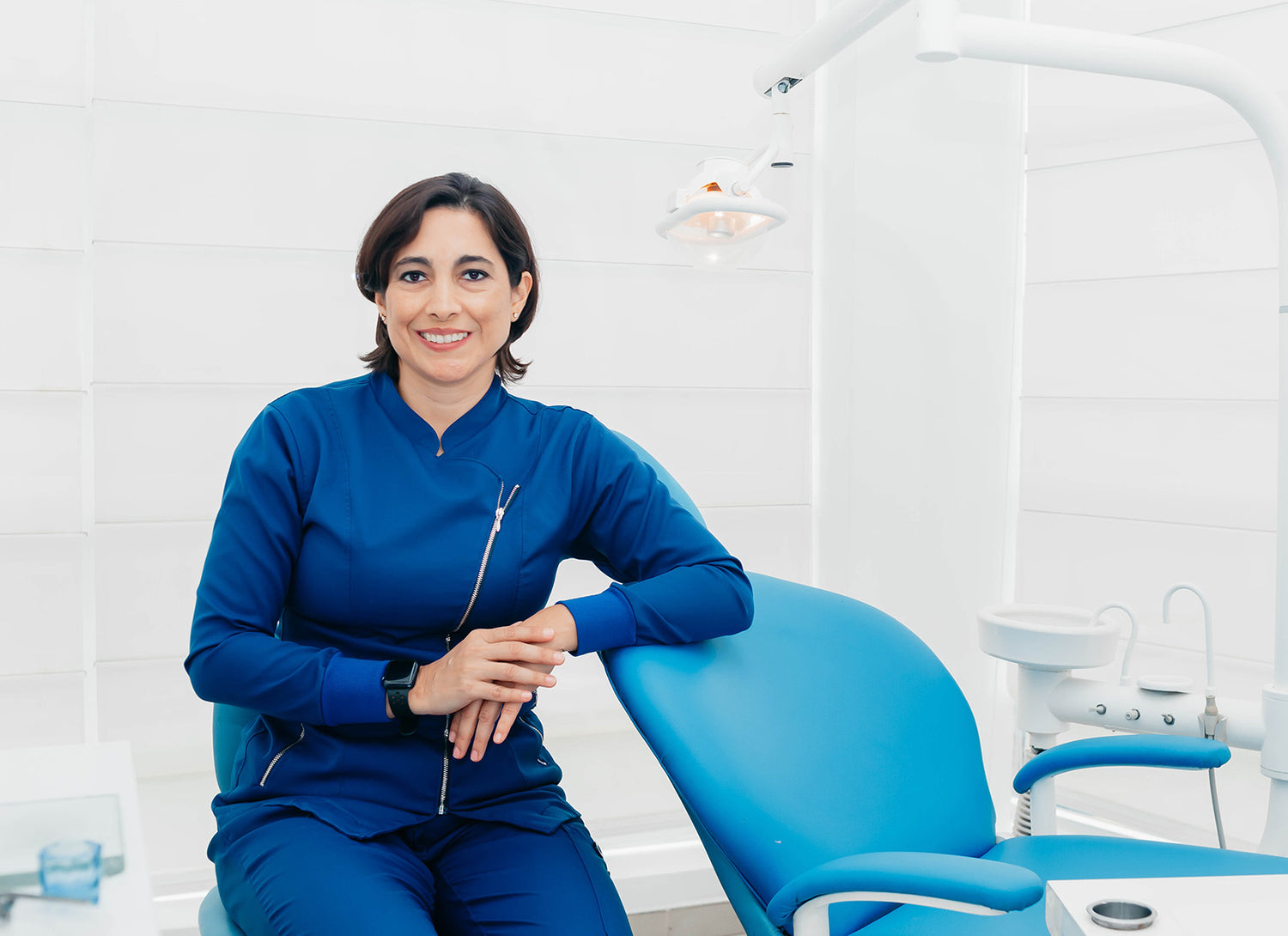 Smiling orthodontist in office